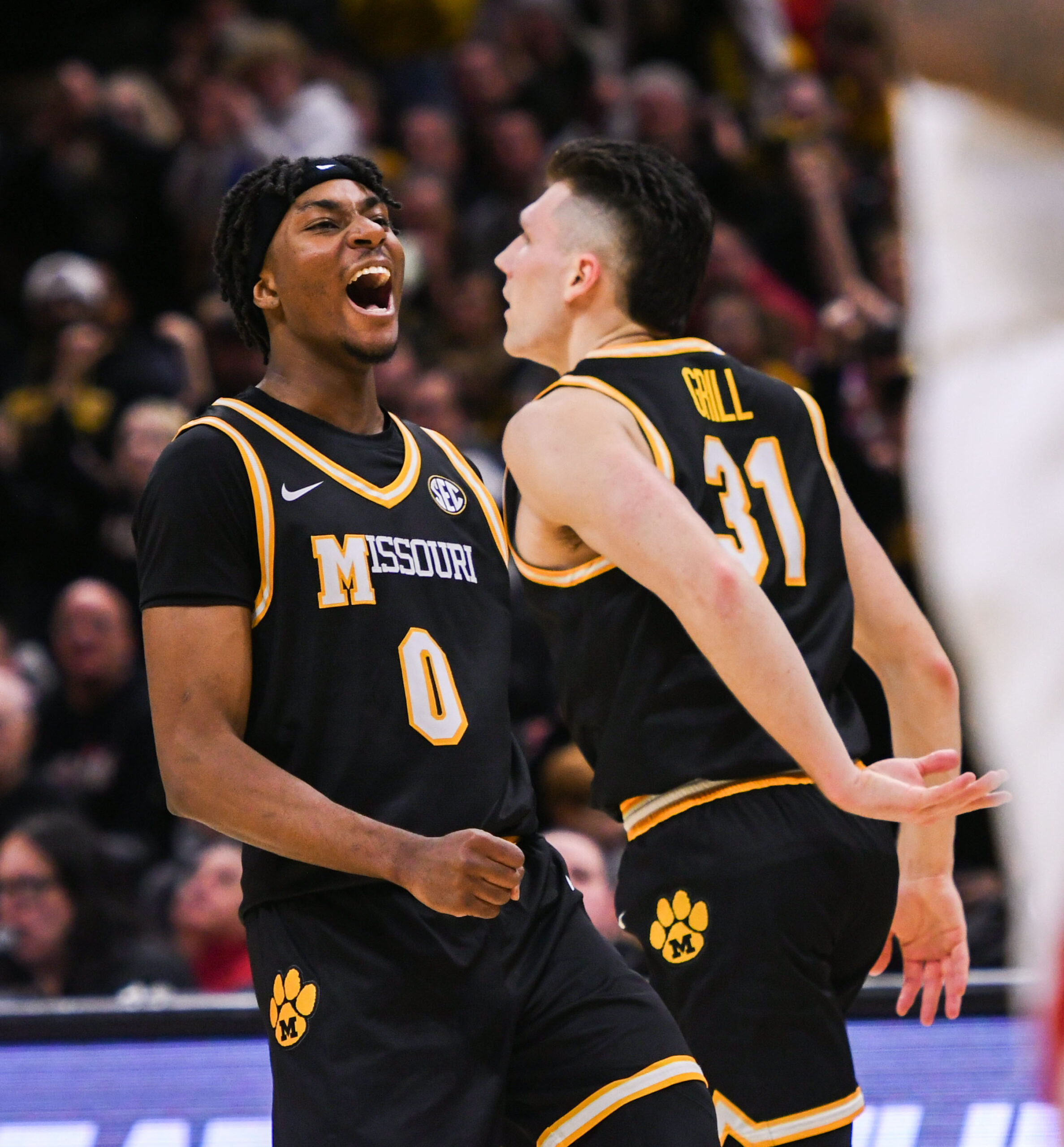 Missouri guards Anthony Robinson II and Caleb Grill celebrate beating Arkansas during the second half of a game on Saturday, January 18th, 2025.